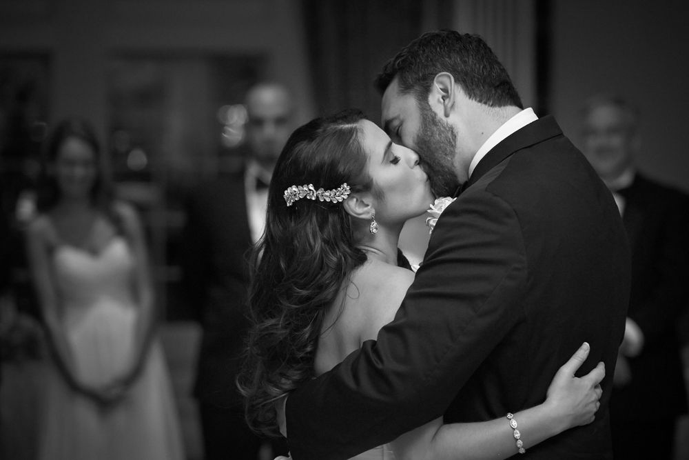 A romantic black and white photo series showing couples dancing and embracing at an elegant Philadelphia wedding reception