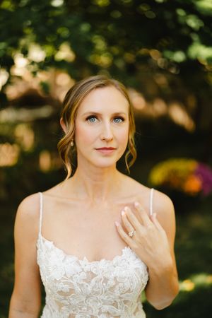 Close-up bridal portraits in natural lighting with lace dress details.