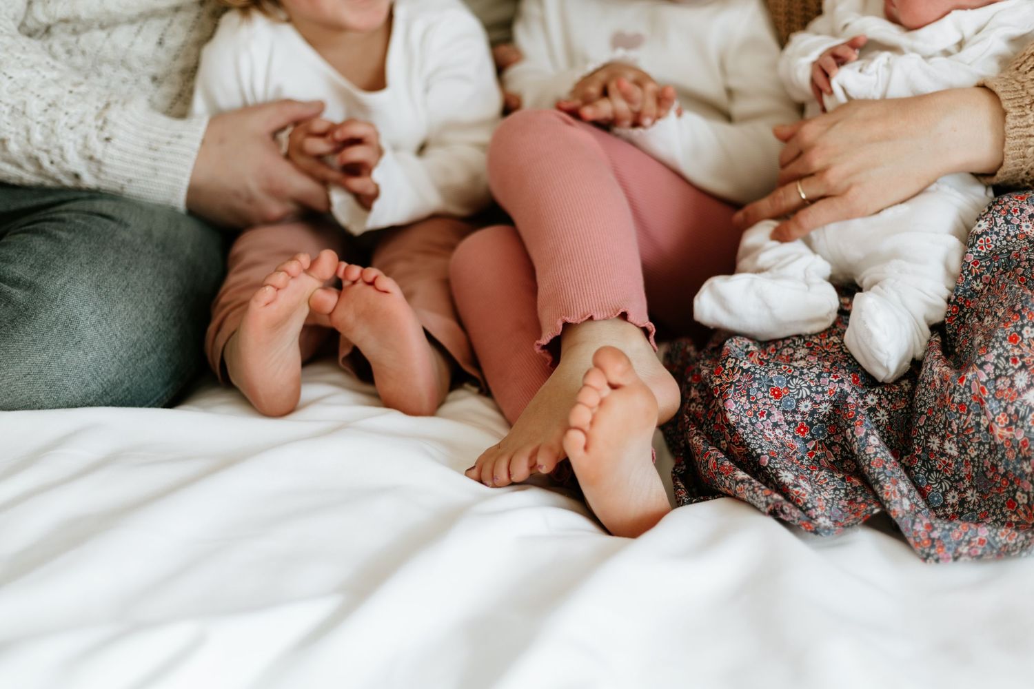 photo of family hugging during a newborn photoshoot.