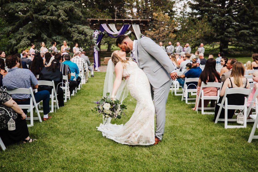 Bride and groom kissing in the aisle in Cheyenne, WY
