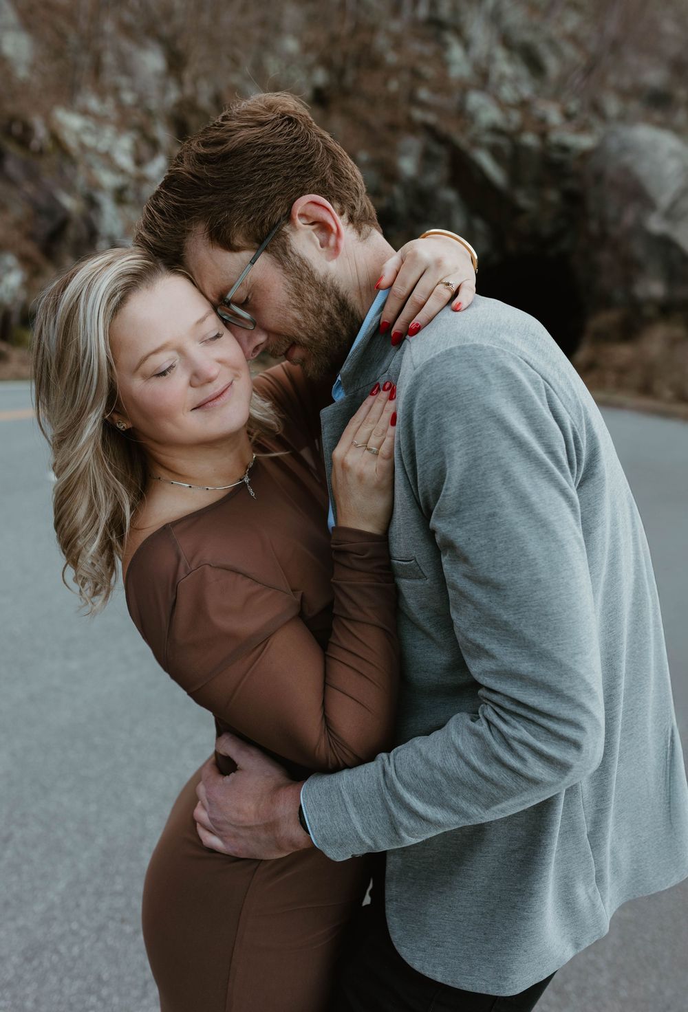 An intimate sequence of a couple sharing tender moments in grey and brown clothing.