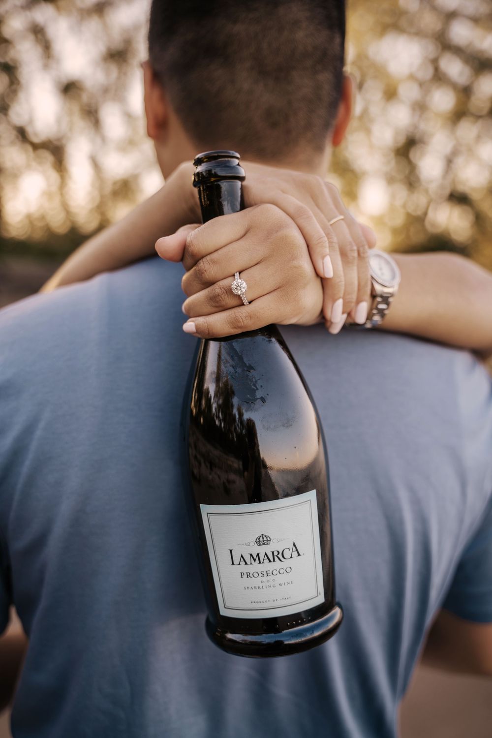A sequence of photos showing a wine bottle being held against a blue shirt in natural outdoor lighting.