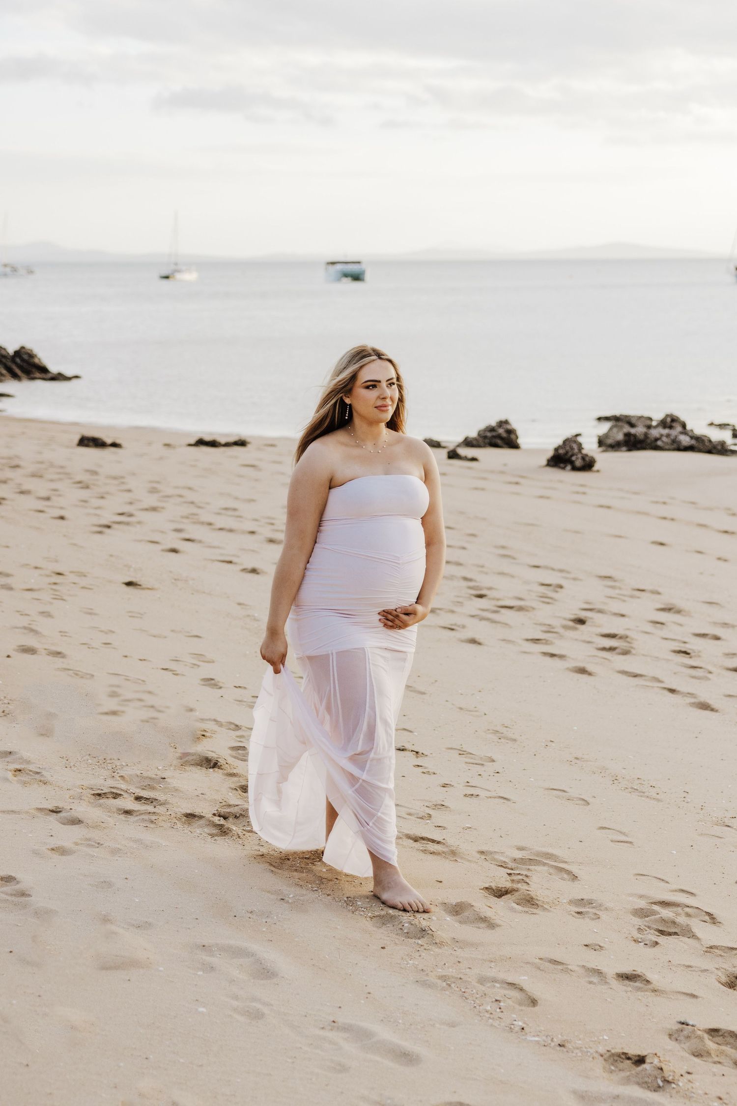 maternity photographer airlie beach whitsundays beach photoshoot pregnancy beautiful pale pink dress sunset golden hour hideaway bay