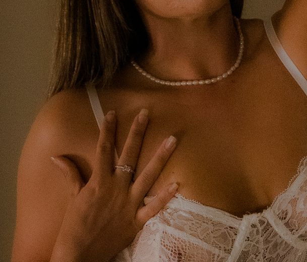 A woman posing for a boudoir photo