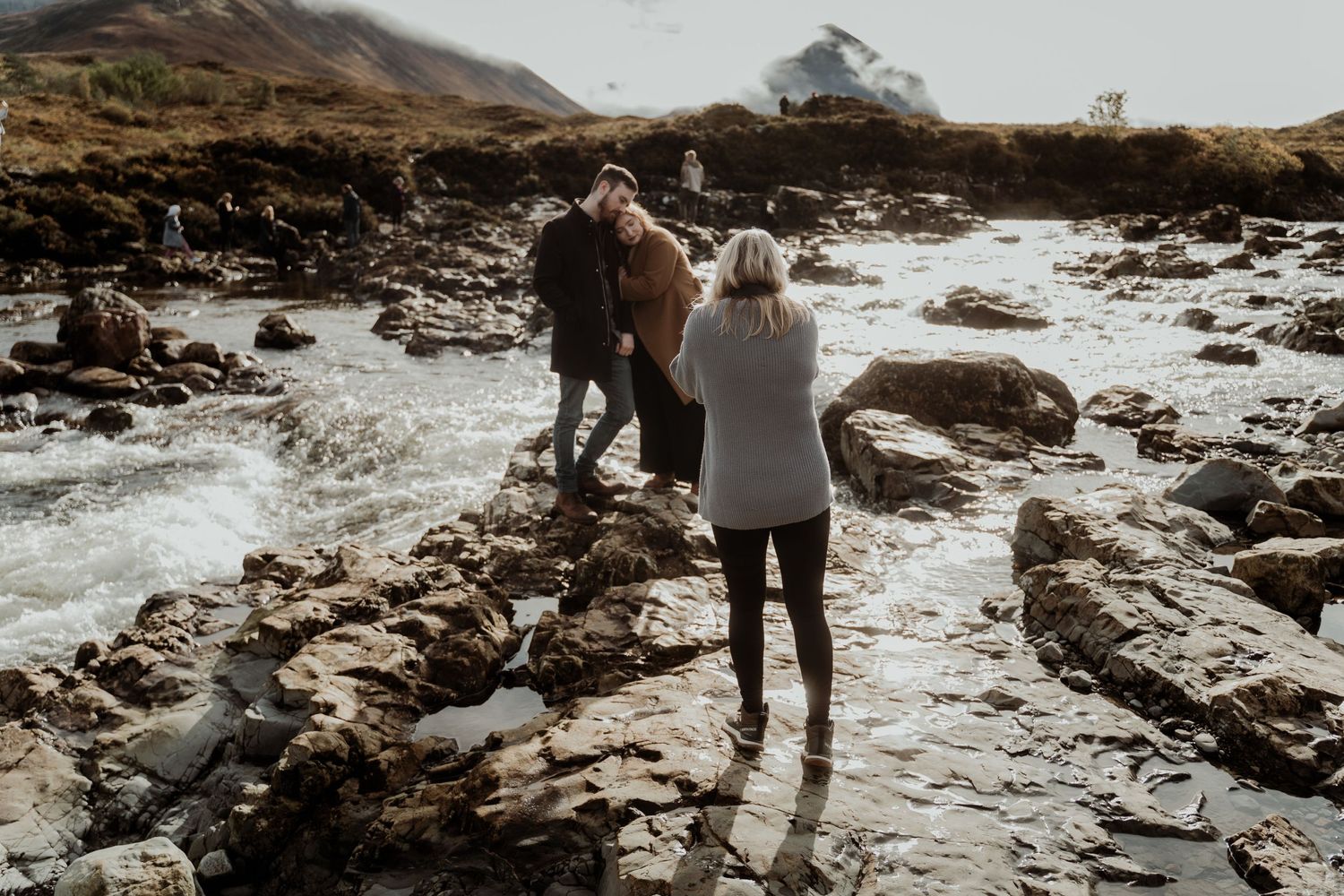 Adventurous couple being photographed in Sligachan on the Isle of Skye