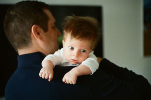 in-home newborn film photoshoot in San Francisco Bay Area with natural light, intimate connection and cinematic film tones