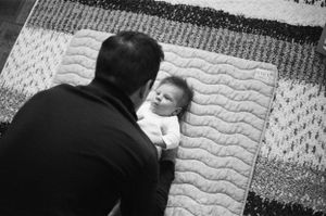 in-home newborn session with natural light, intimate connection and cinematic film tones