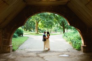NYC engagement photographer capturing candid couple portraits in Central Park with natural light and film photography