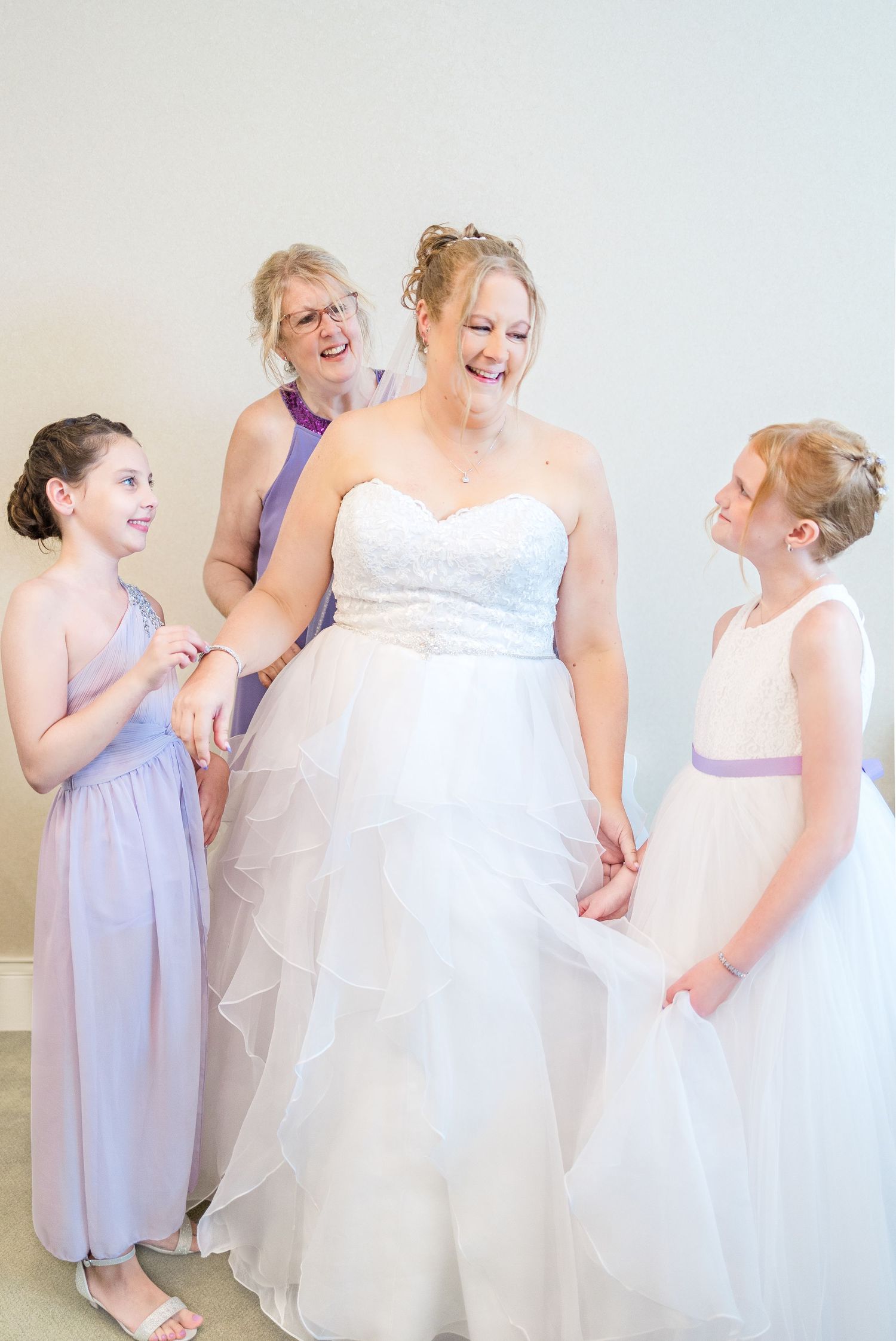 A joyful moment of laughter shared during wedding preparations.