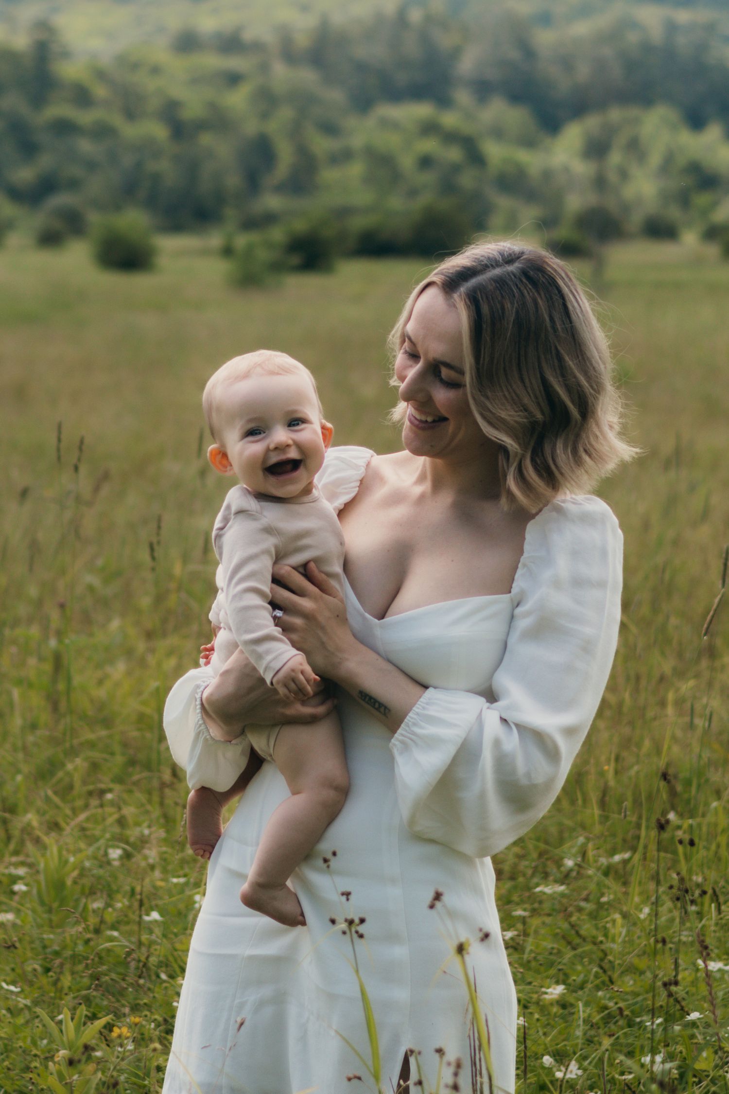 Mother Breanna holding baby Esme in a heartfelt moment.