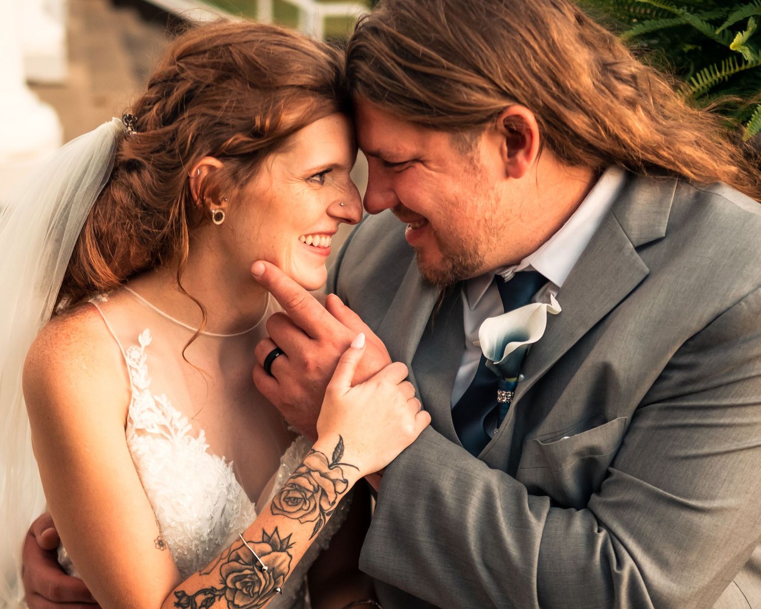 Romantic wedding couple portraits showing intimate moments in natural lighting.