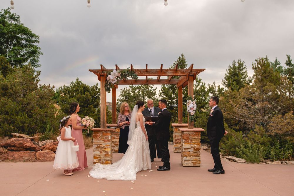 A collage of seven outdoor wedding ceremony moments at a rustic garden venue with wooden pergolas.