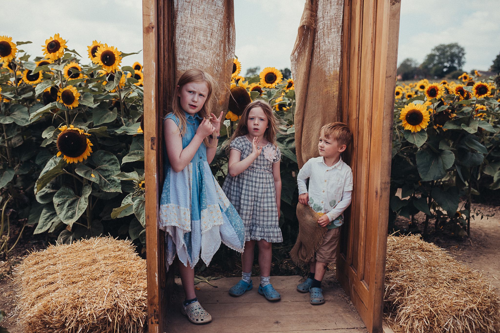 photography by Chelle Lundy of wild children outside at Farmer Copleys Sunflower Farm in Pontefract, West Yorkshire