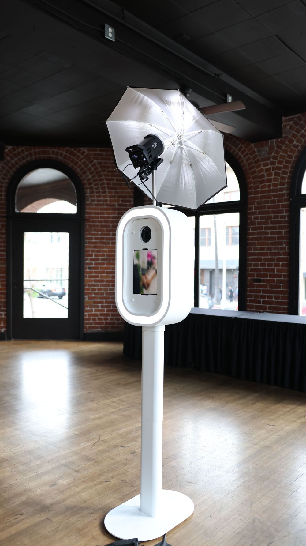 Close-up of a high-resolution DSLR camera in an elegant photo booth setup
