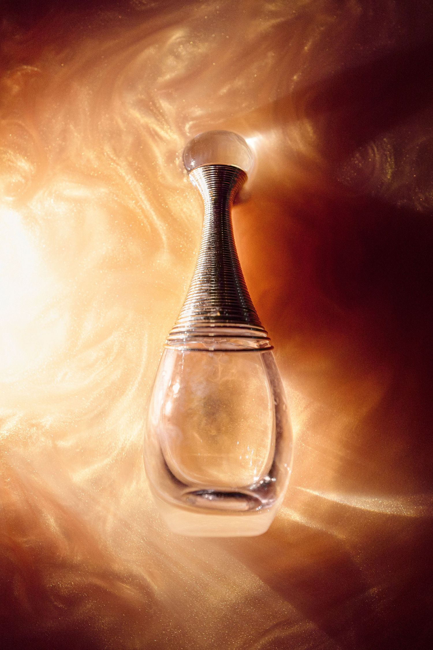 J'adore dior perfume bottle in light and sparkles