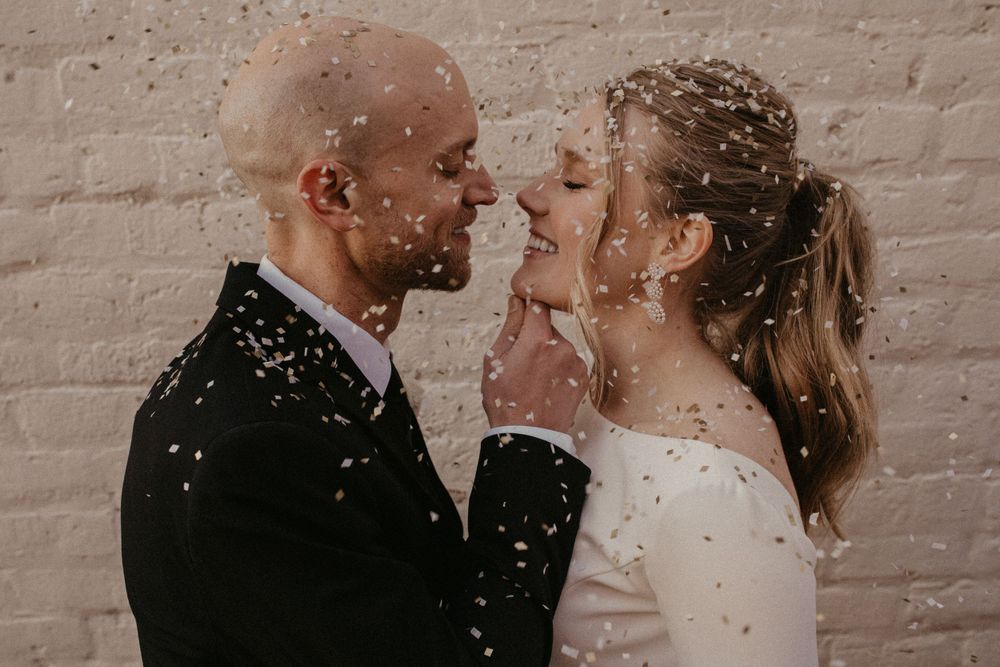 A romantic photo collage showing tender moments between a couple kissing against a rustic brick wall background.