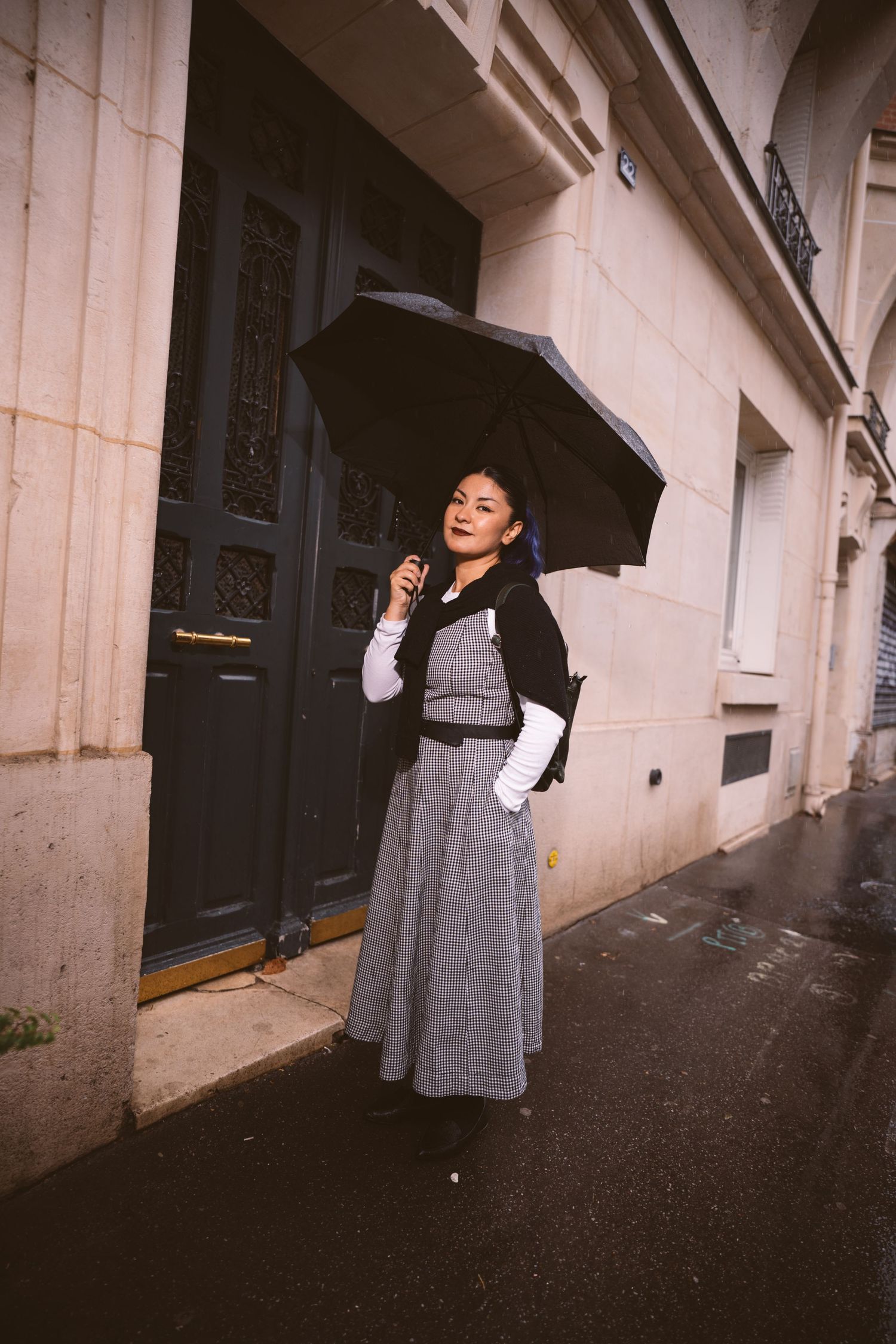 Casual portrait session showing photographer with camera sitting on white platform.
