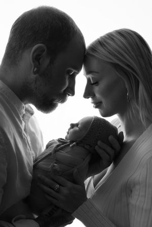 newborn baby with parents photo