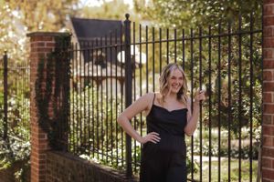 girl laughs in a courtyard