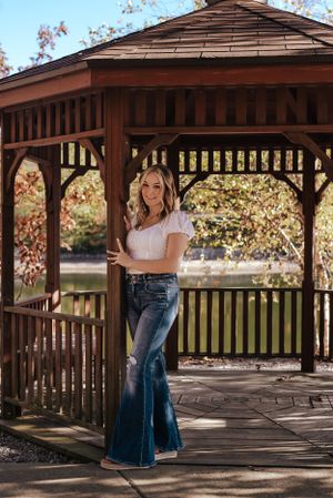 teen girl standing in front of a gazebo