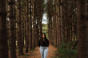 girl in pine grove