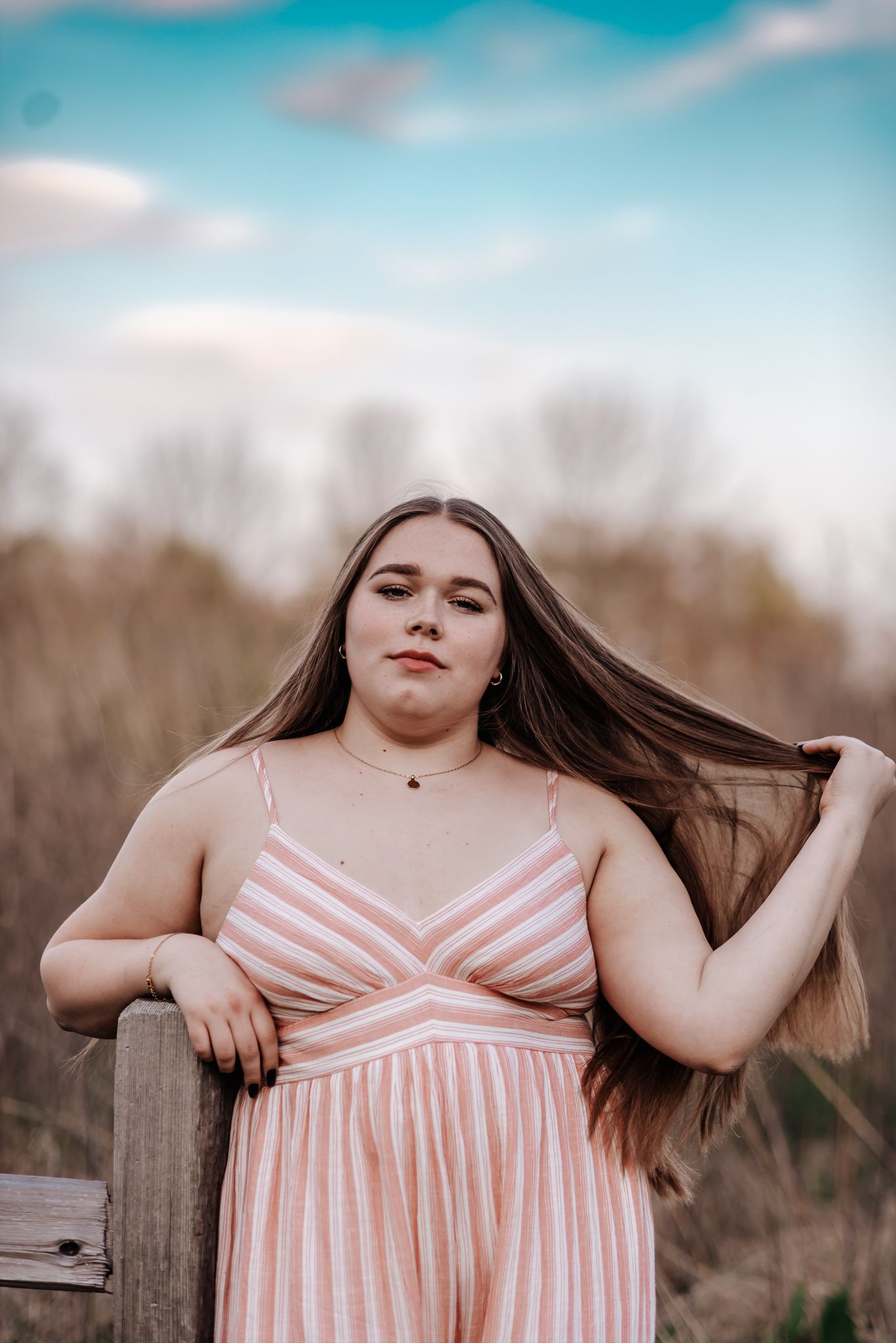 girl in striped romber under blue sky