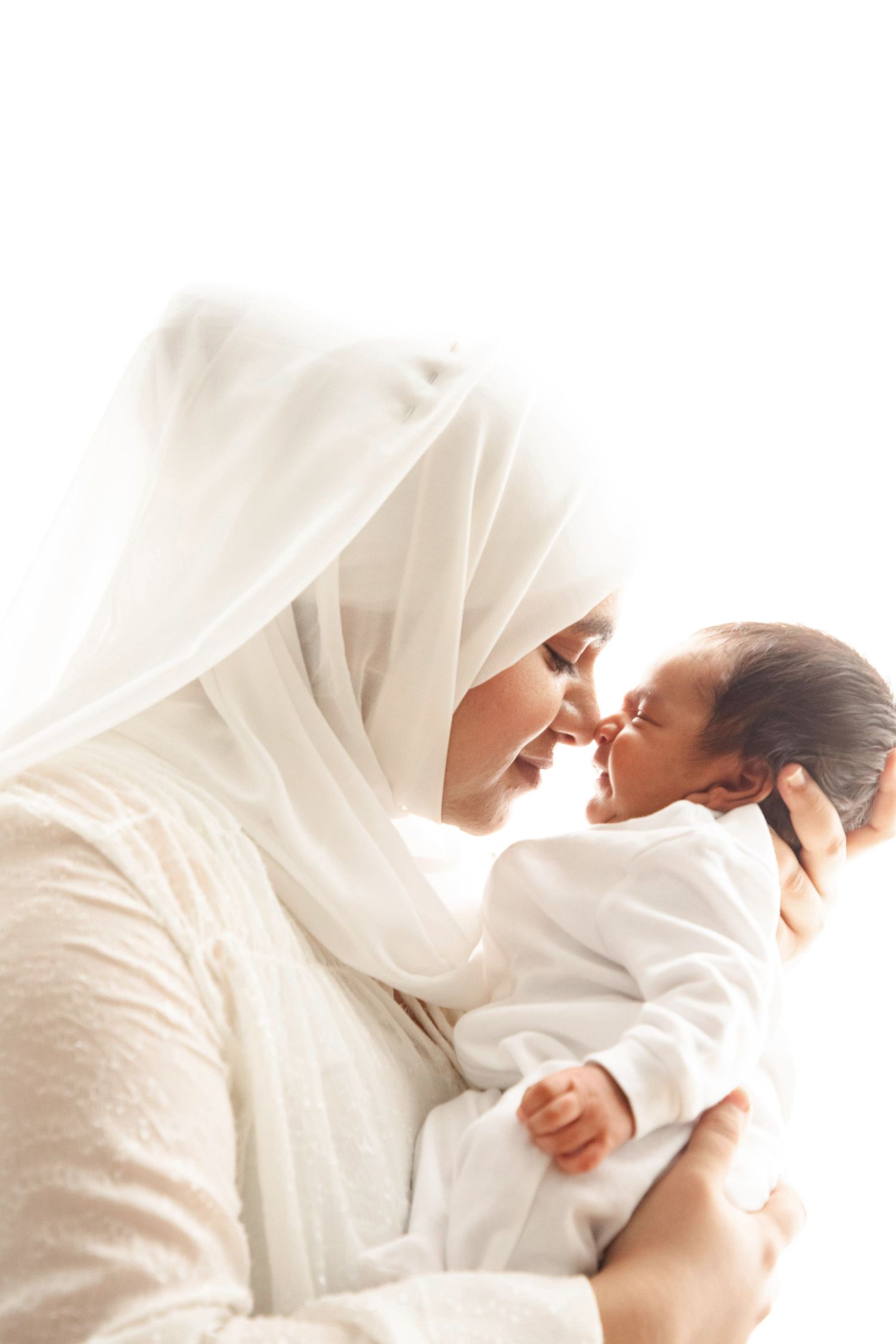 Intimate portrait photography series with white fabric and soft lighting.