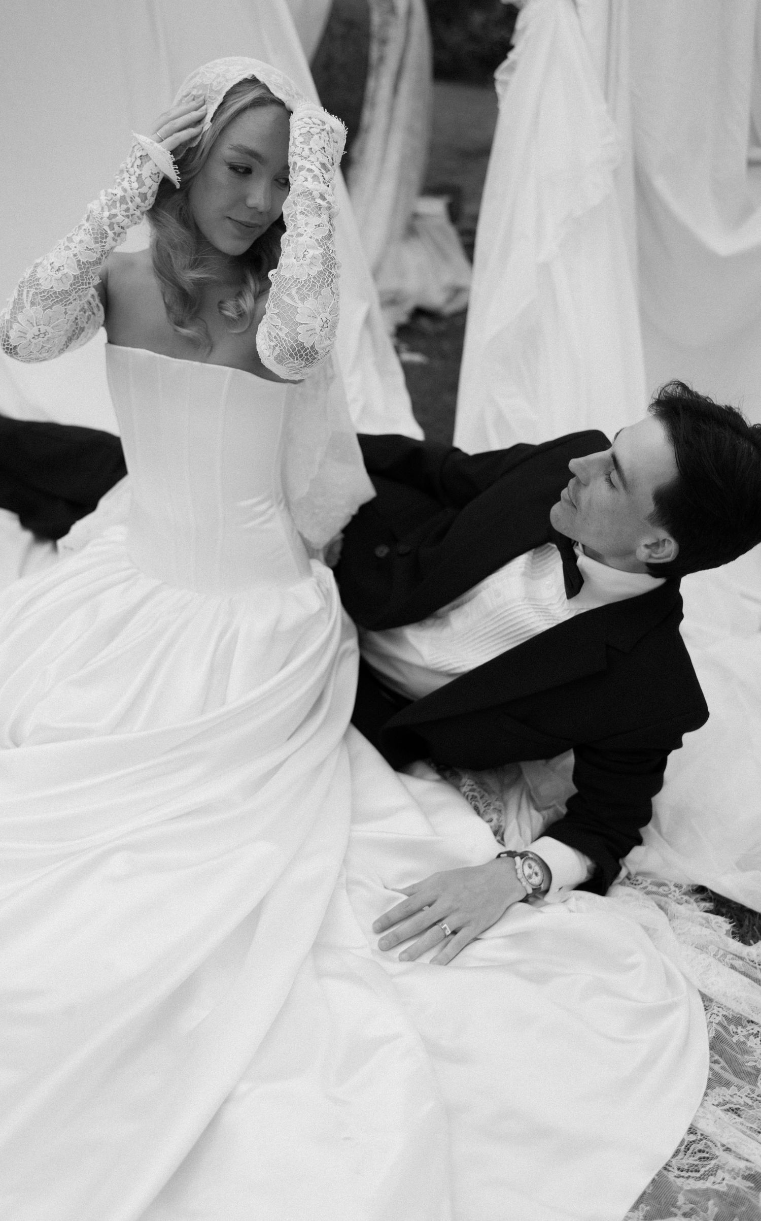 Black and white romantic dance sequence showing elegant movements between newlyweds in formal attire.