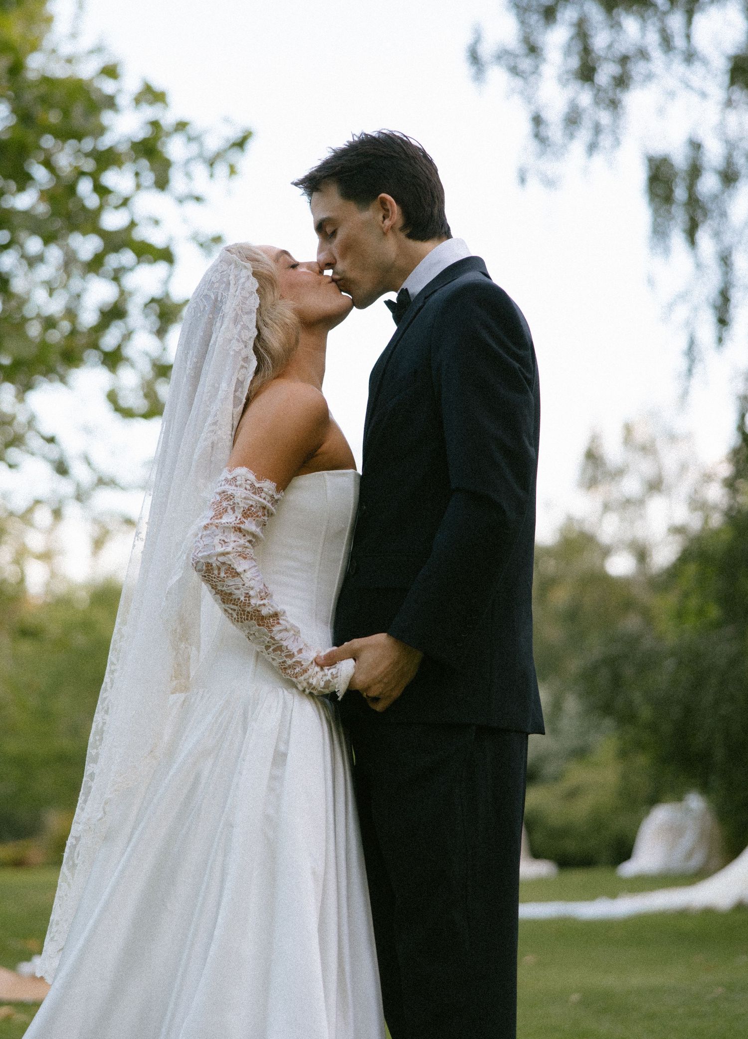 A romantic wedding sequence showing a couple sharing intimate moments in a garden setting.