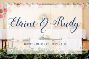 Navy blue wedding signage displays 'Elaine & Rudy Butte Creek Country Club' against a floral backdrop.