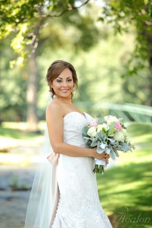 A beautiful bridal portrait in a garden setting with a soft focus natural background.