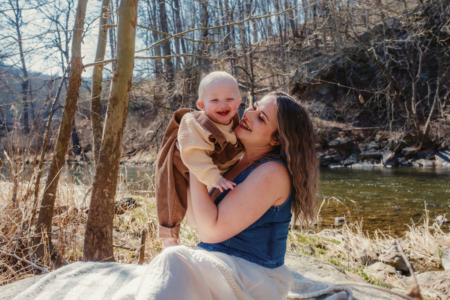 Joyful outdoor celebration with family in sunny woodland.