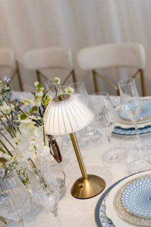 Luxury tablescape with florals, crystal glassware, and fine china at a Palm Beach event design branding photography session.