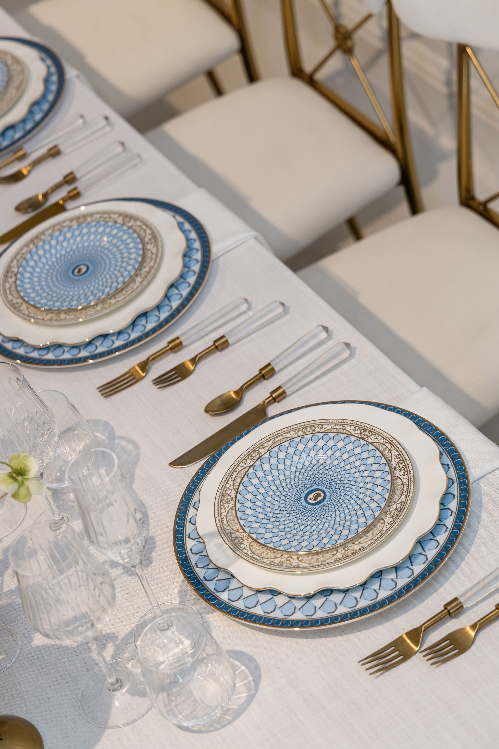 Elegant blue and gold place setting photographed for a luxury event designer in Palm Beach, Florida.