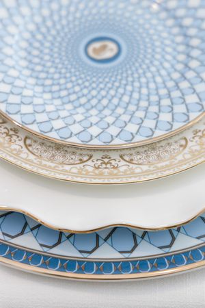 Close-up of luxury fine china with blue and gold detailing photographed for a Palm Beach event designer branding photography session.