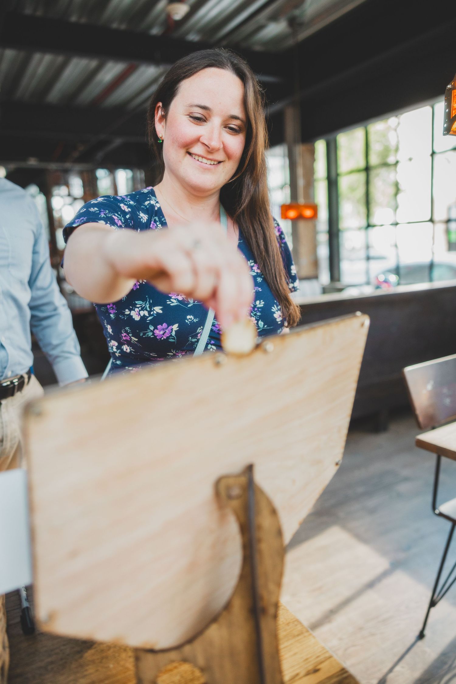 Guest participating in wedding activities at an industrial venue.