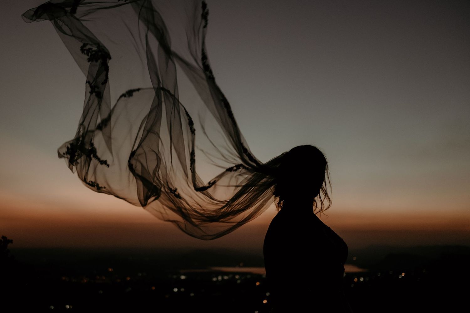 Bride veil waving on wind during sunset elopement at Intiem Weddings Gauteng