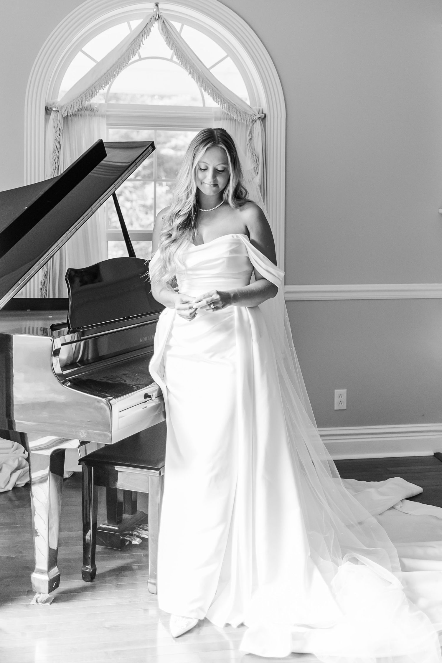 Elegant bridal portraits in black and white with grand piano.
