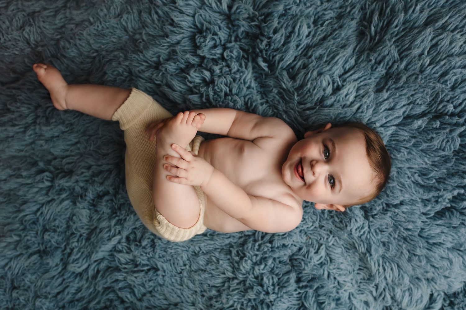 Charlottesville photographer, baby, newborn, maternity, family, milestone, baby boy in diaper cover on blue flokati