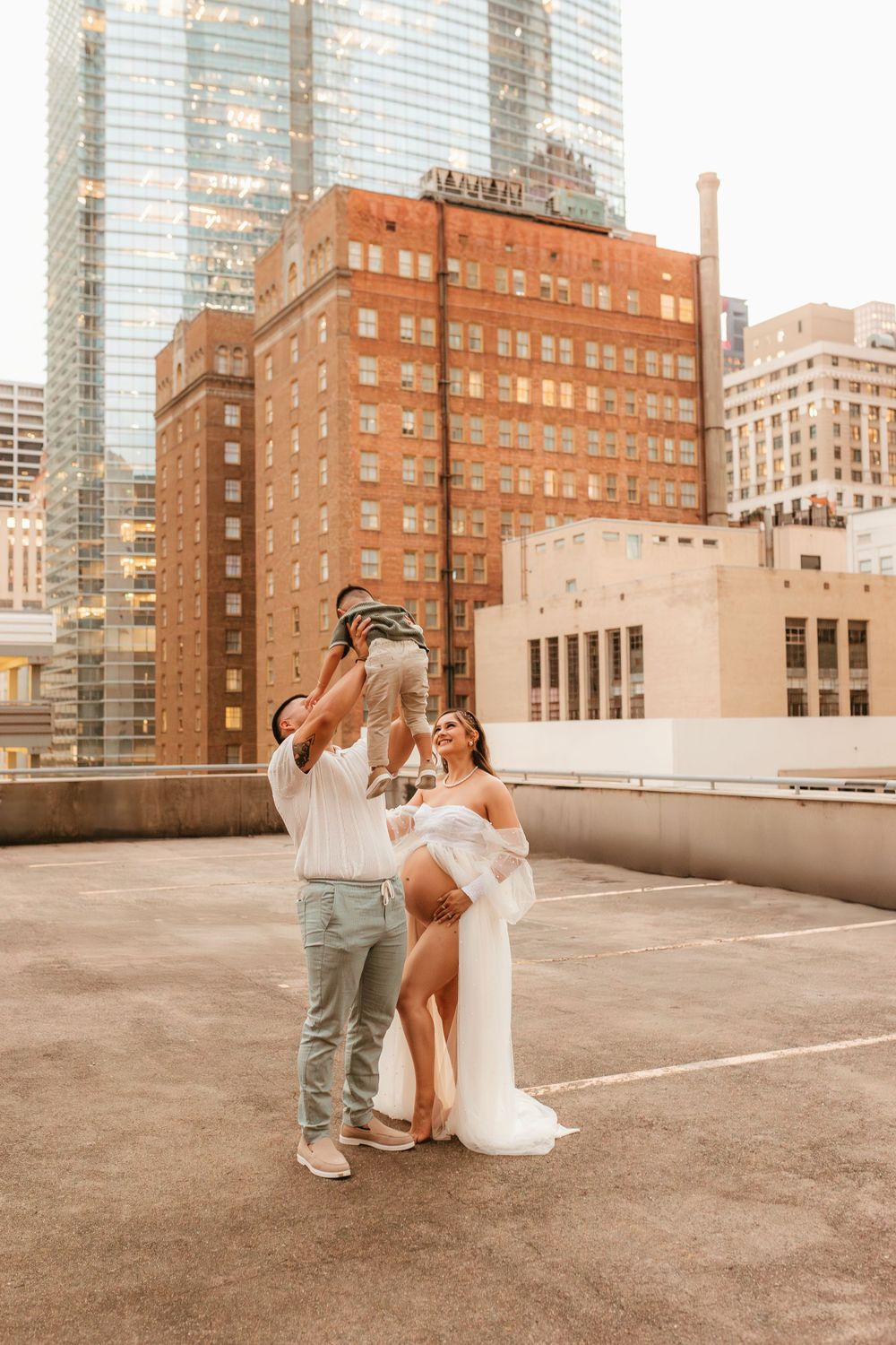 A playful maternity photo session on a Manhattan rooftop during sunset.