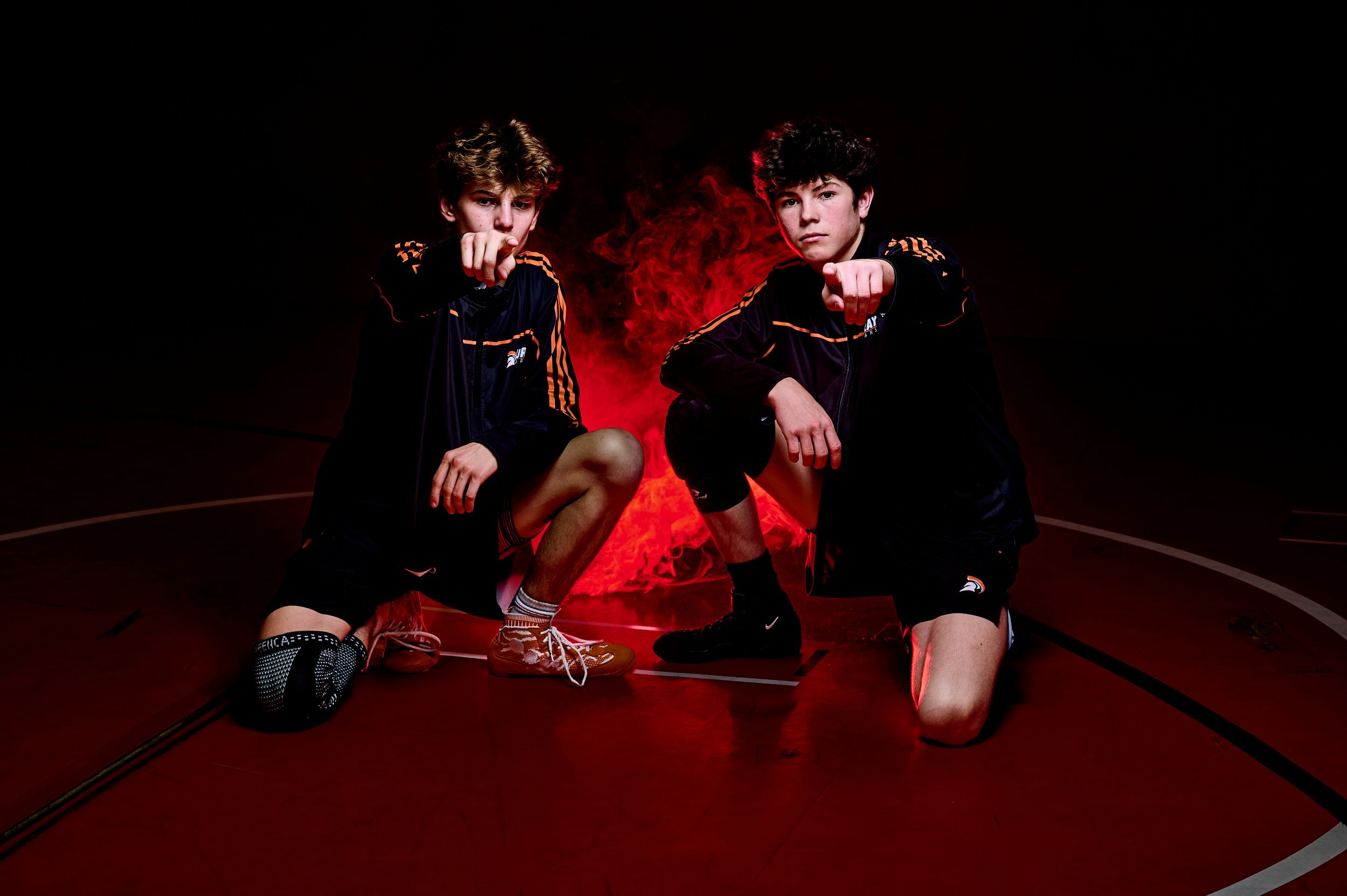 High school wrestler media-day style portrait with dramatic lighting — professional sports photography