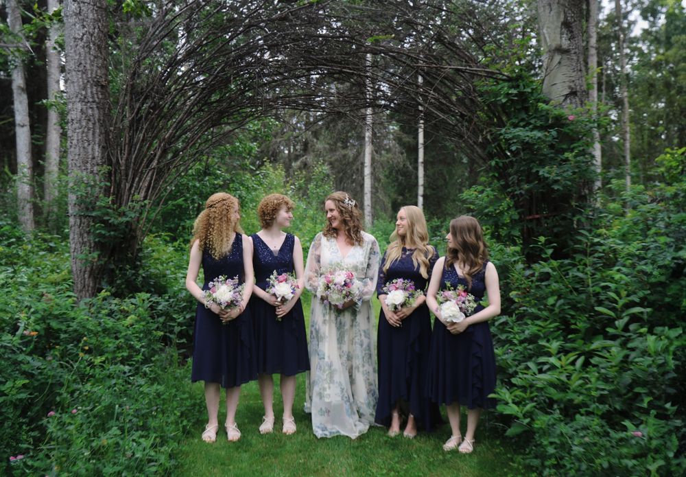 Wedding party poses progressively in a wooded outdoor setting with greenery and natural light.