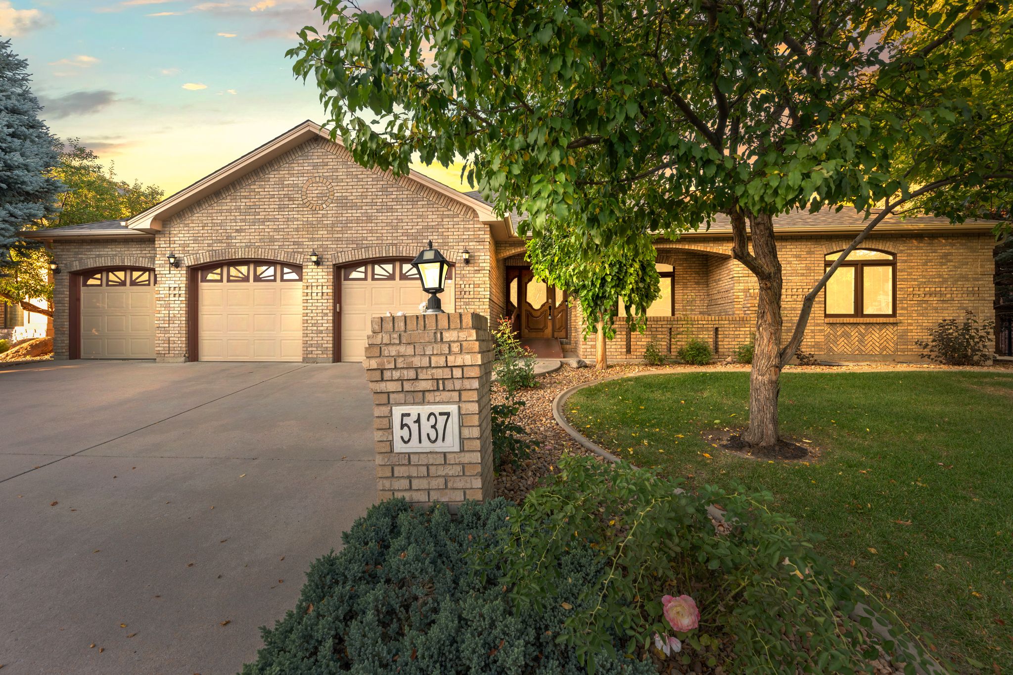 A collage of exterior views showing a modern ranch-style home with well-maintained landscaping at different angles.
