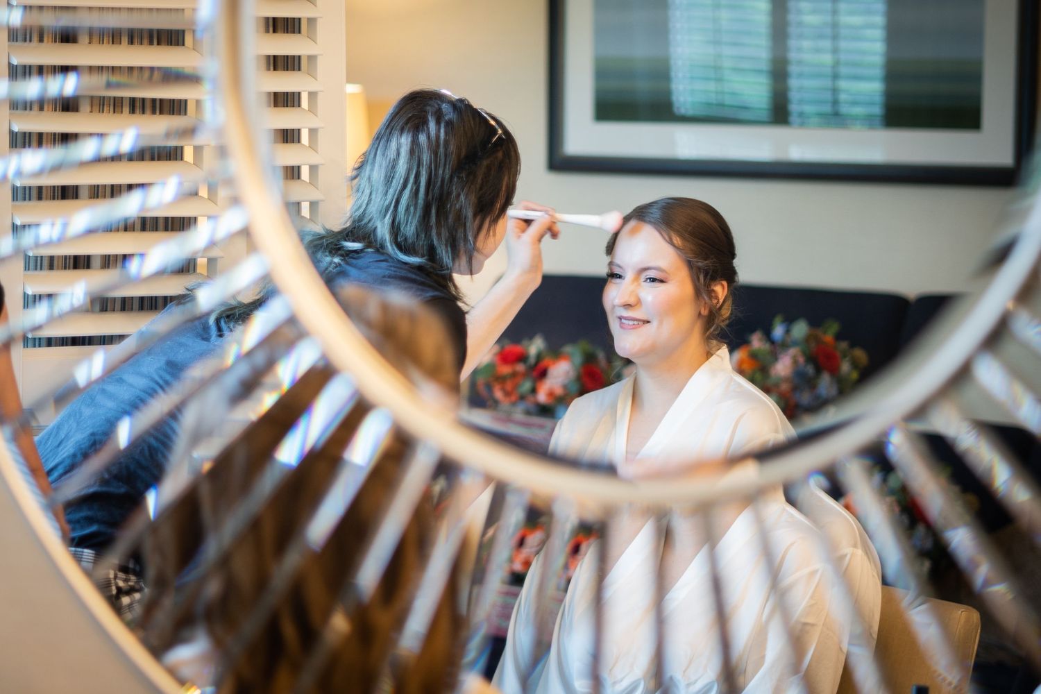 an elegant bride getting make up done