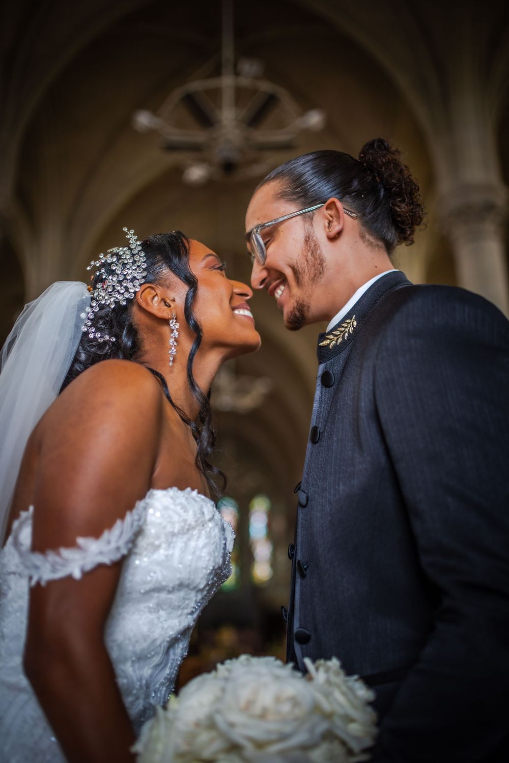 A touching sequence of romantic wedding photos showing intimate moments between the happy newlyweds in a beautiful church setting.