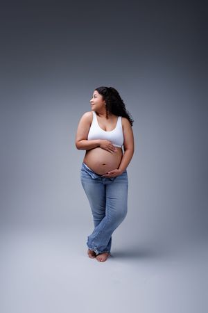 Midland TX maternity photographer photographers midland tx studio maternity portrait session white top blue jean maternity session maternity
