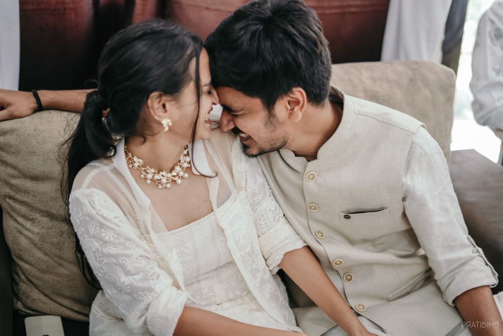 Couple in coordinated outfits share loving glances in multiple candid shots.