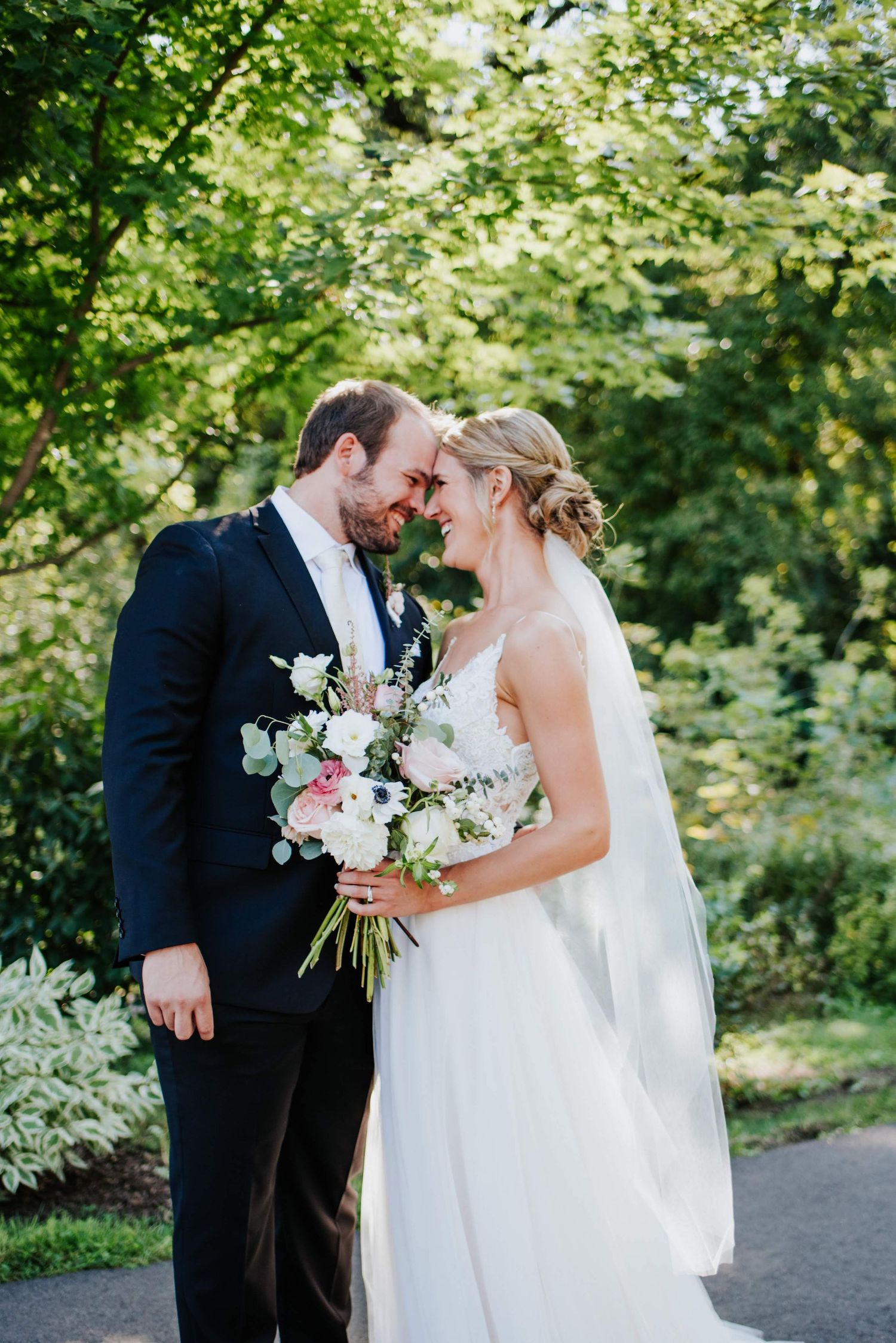 Romantic wedding sequence with couple holding bouquet in a garden setting.