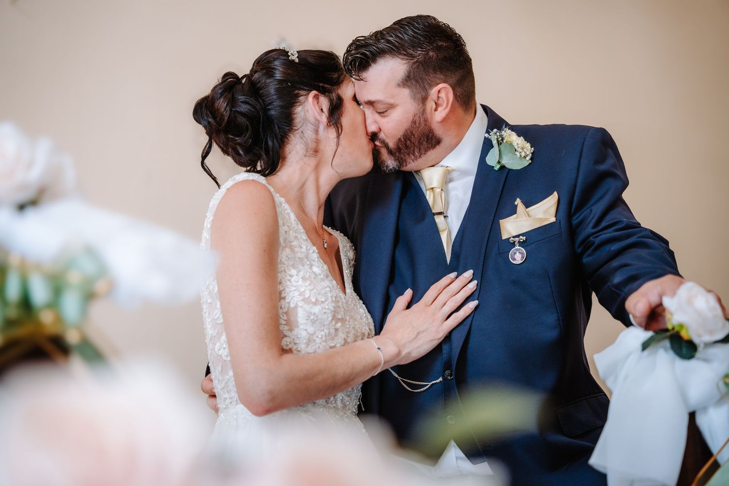 A romantic wedding dance moment captured in a softly lit indoor venue.
