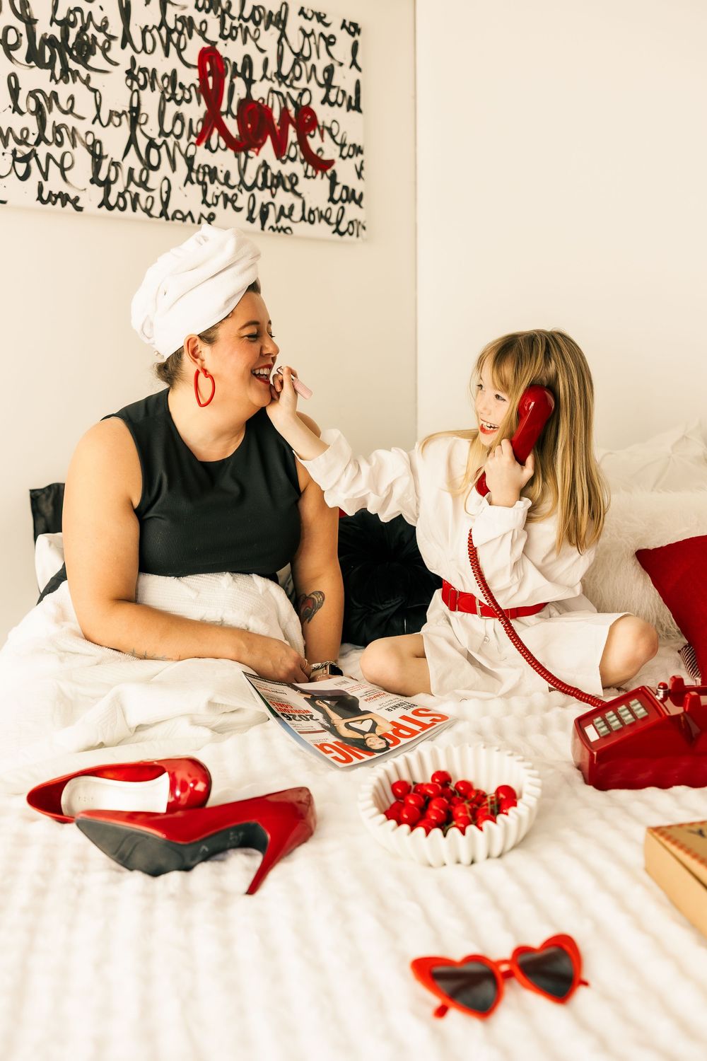 A series of four photos showing someone lying on white bedding with red accents while reading and relaxing.